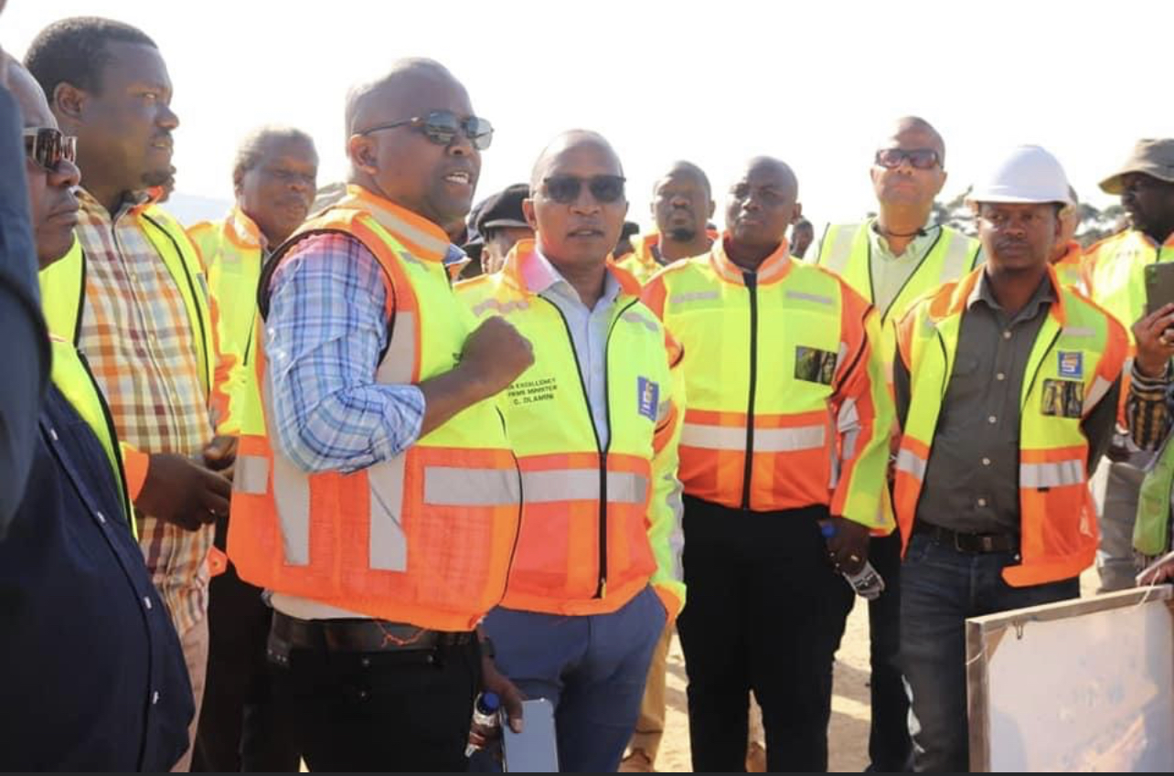 Prime Minister Cleopas Sipho Dlamini tours under construction Sibovu Sigcineni Road.