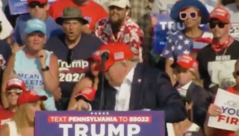 Former United States President Donald Trump shot at campaign rally,rushed out of stage.