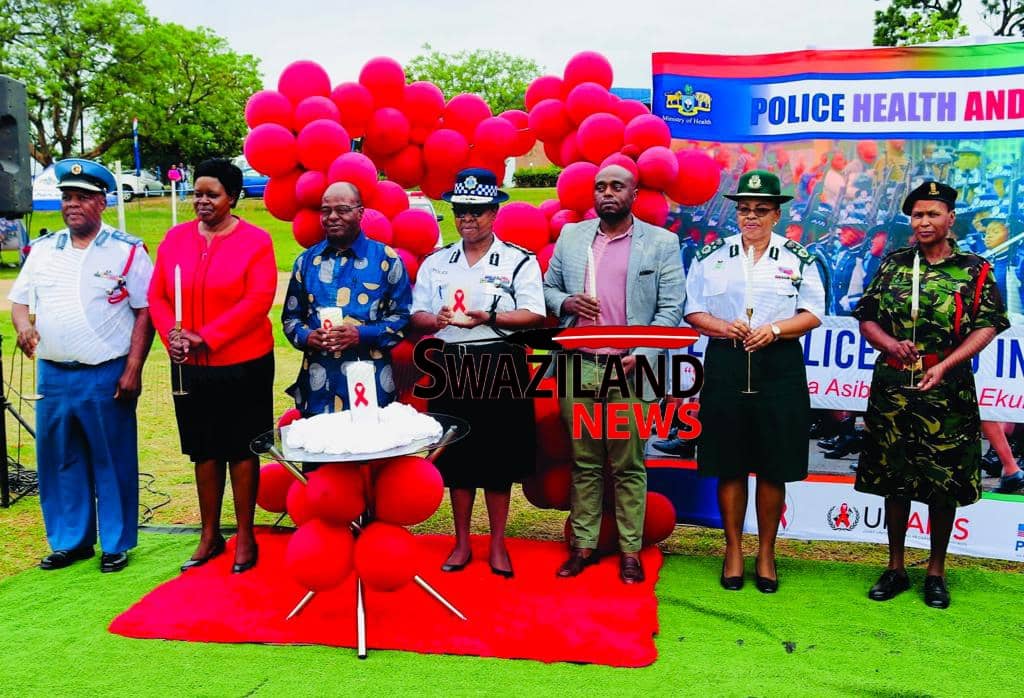 Police Acting National Commissioner Lydia Dlamini conducts candle lighting in remembrance of officers who died of HIV/AIDS.