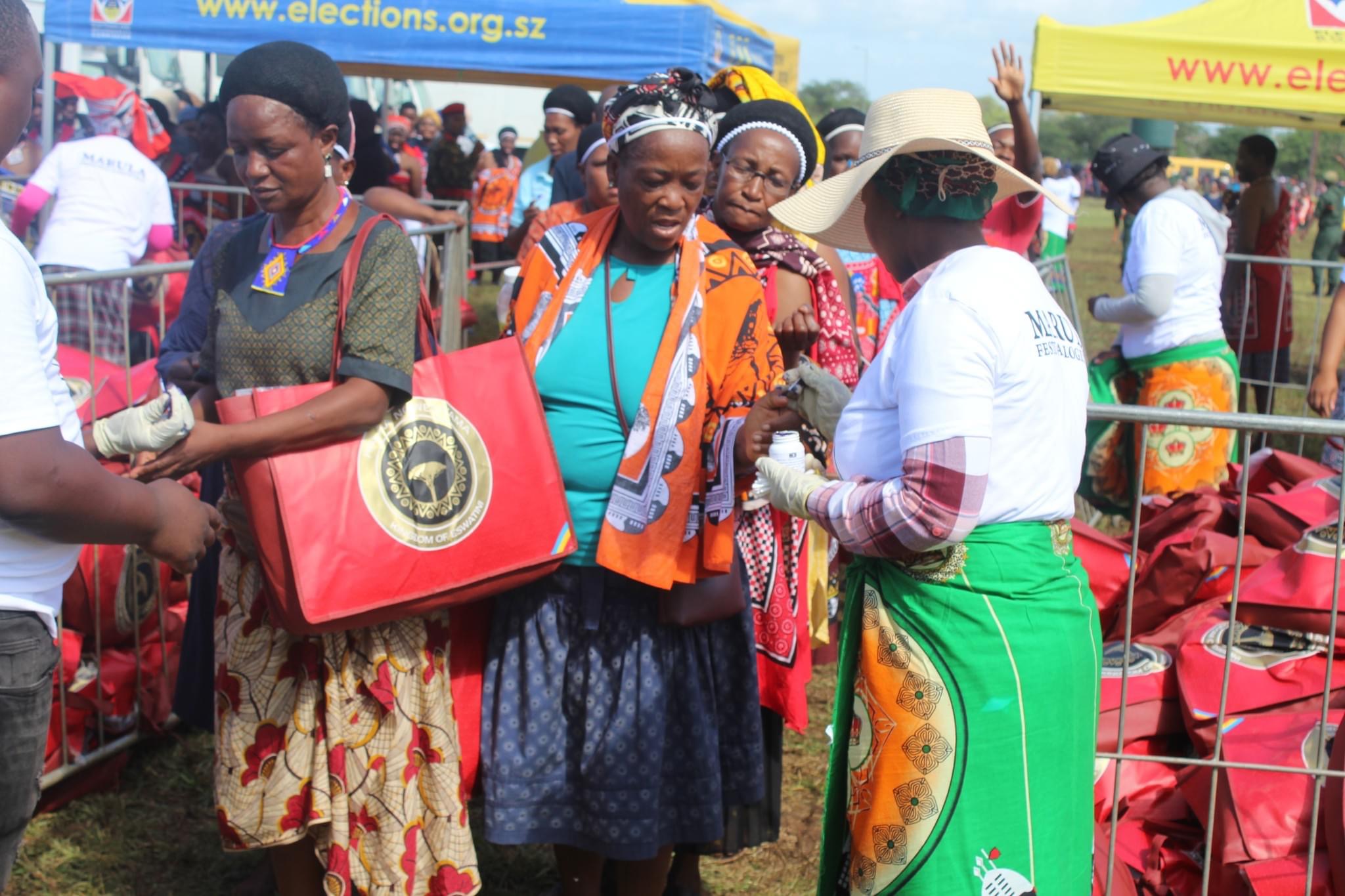 King Mswati presents gifts to members of Lutsango at Hlane Royal Residence.