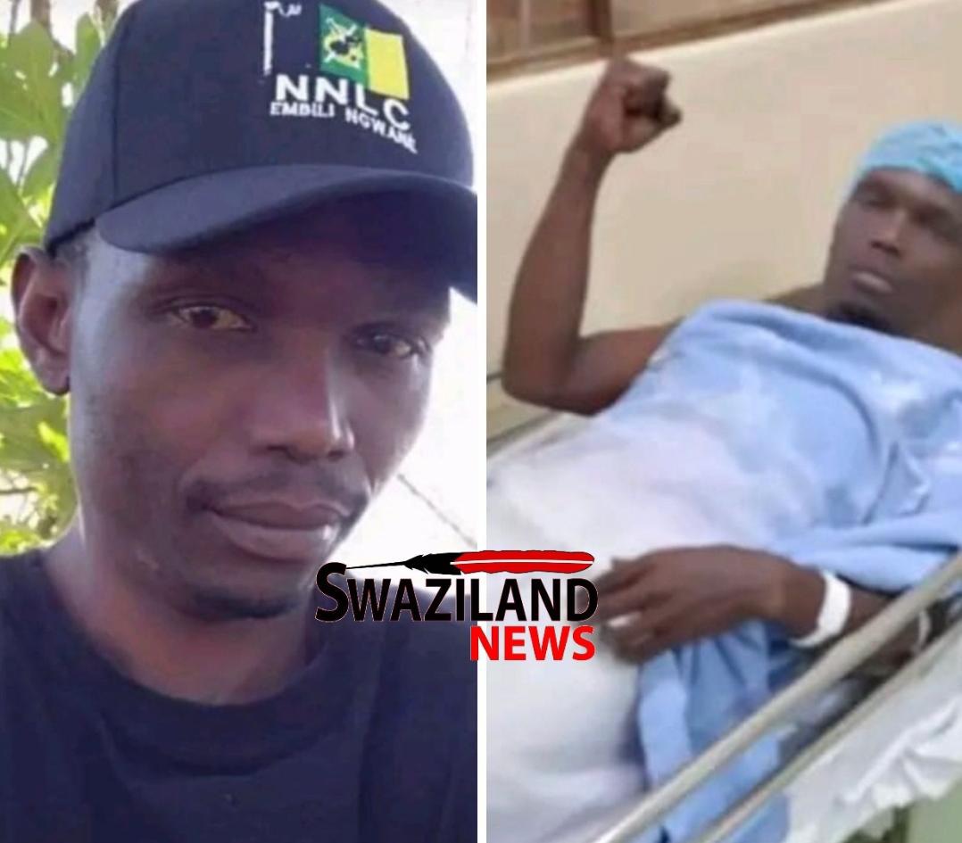 Shot NNLC member Vusi Mamba raises clenched  ‘Amandla’ fist in his hospital bed.