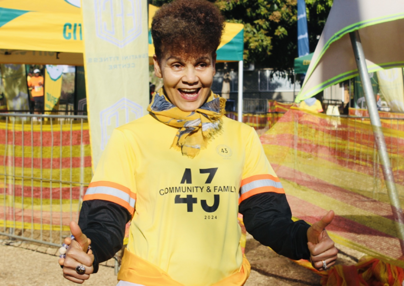 Commerce Minister Mancoba Khumalo congratulates Far East Textiles Managing Director Tokky Hou for winning Africa Women Manufacturer of the Year Award.