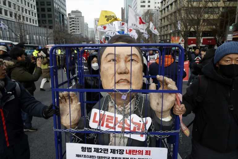 South Korean President Yoon Suk-yeol removed from office by Parliament for imposing martial law.