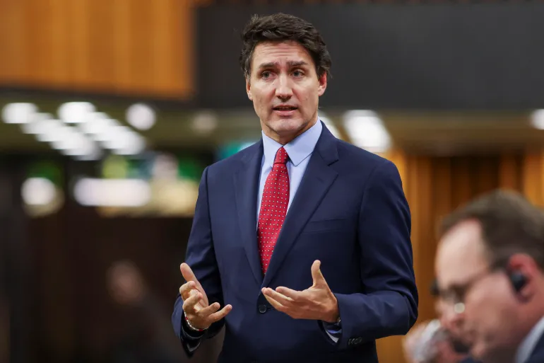 Canadian Prime Minister Justin Trudeau reshuffles Cabinet amid persistent pressure to resign.