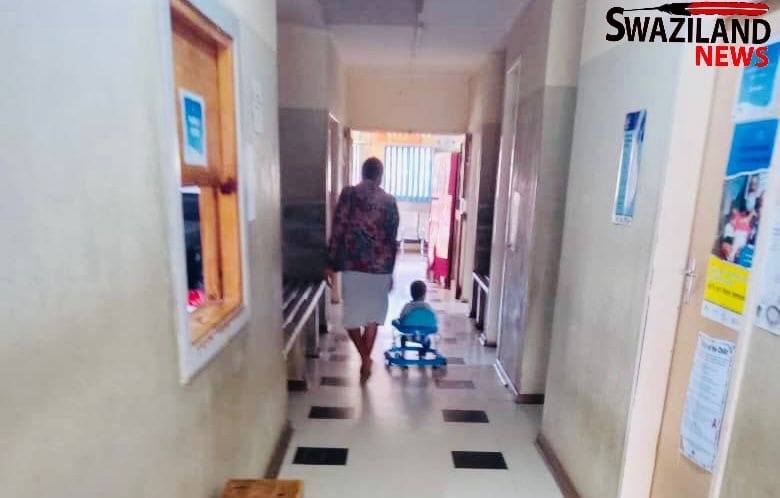 Sinceni Clinic nurse LaThring plays with her one(1)year-old child during work hours, health workers across the country grounded with no working equipment while emaSwati die amid shortage of drugs in public hospitals. 